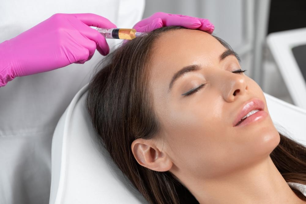 Provider administering PRP injections to a patient’s scalp